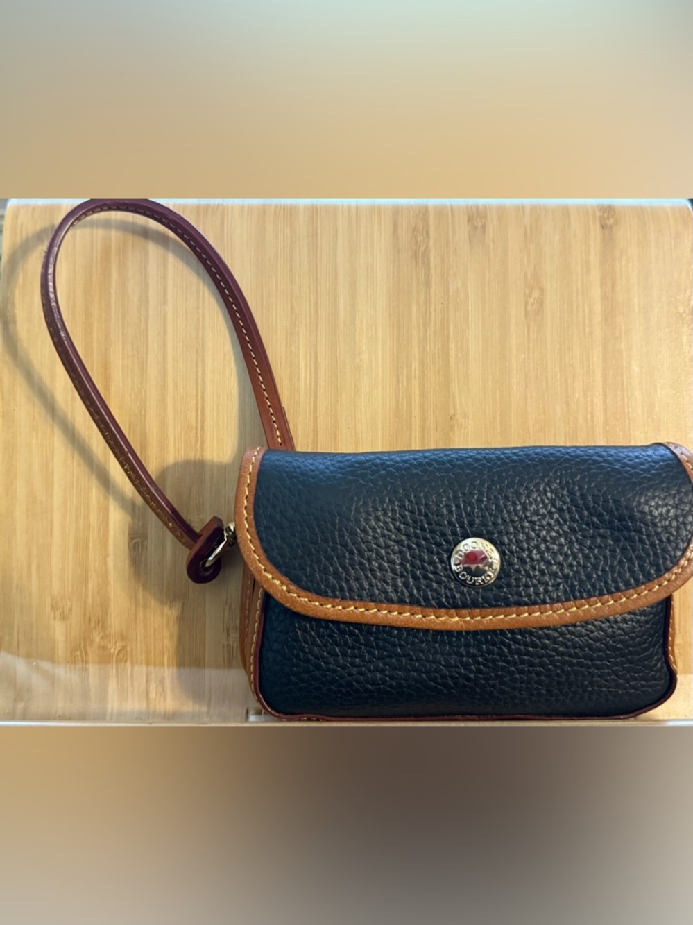 Dooney & Bourke Black Pebble Leather Wristlet with Brown Trim